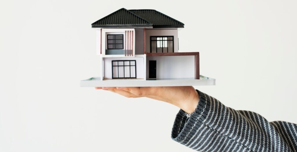 Hand Presenting Model House Home Loan Campaign E1736357661398.jpg